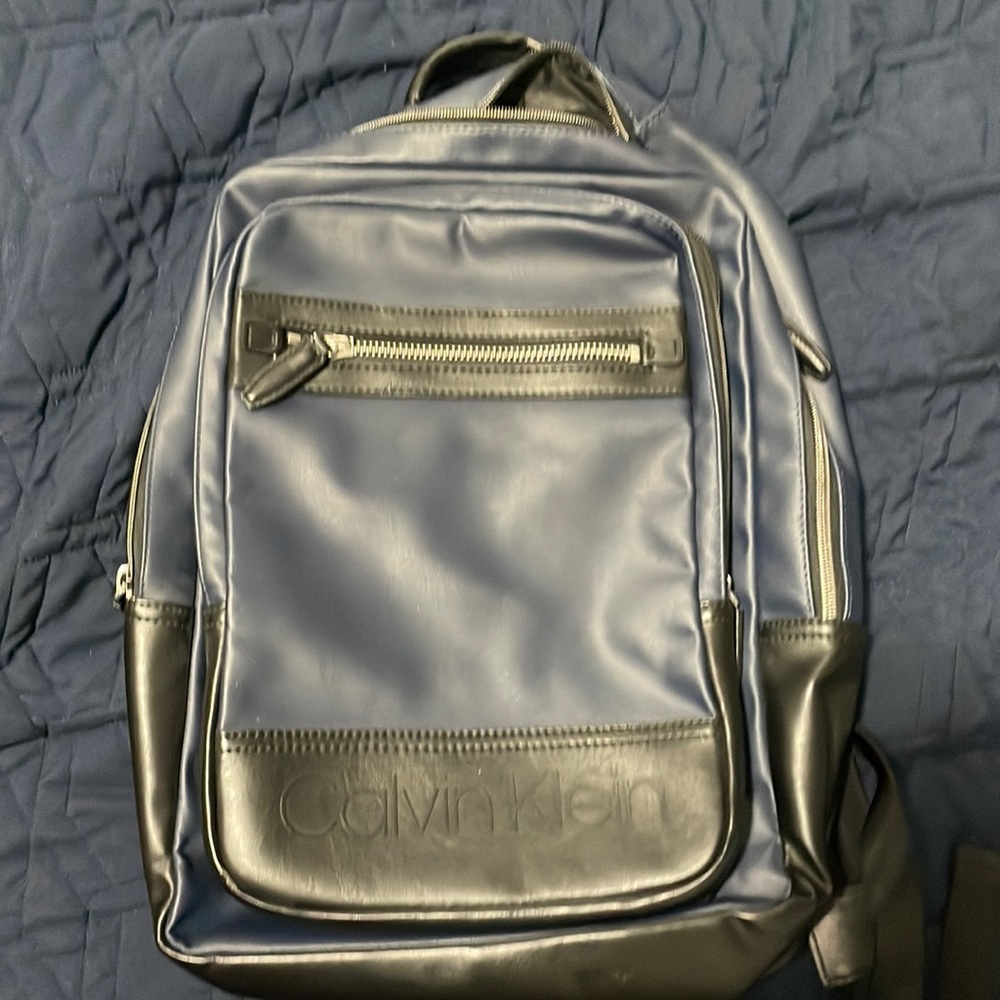 Blue and black Calvin Klein backpack